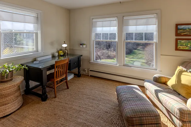 a bedroom with furniture and windows