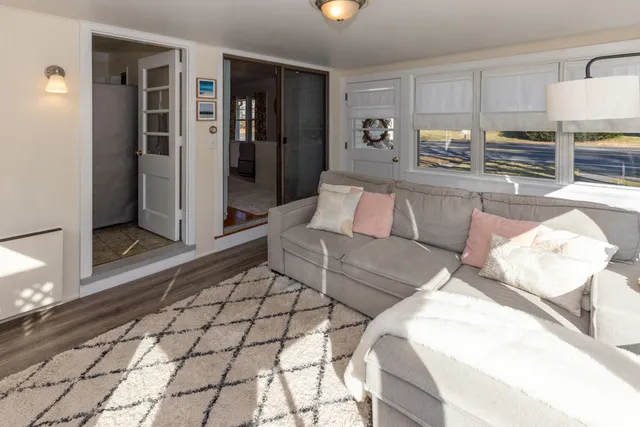 a living room with furniture and a rug