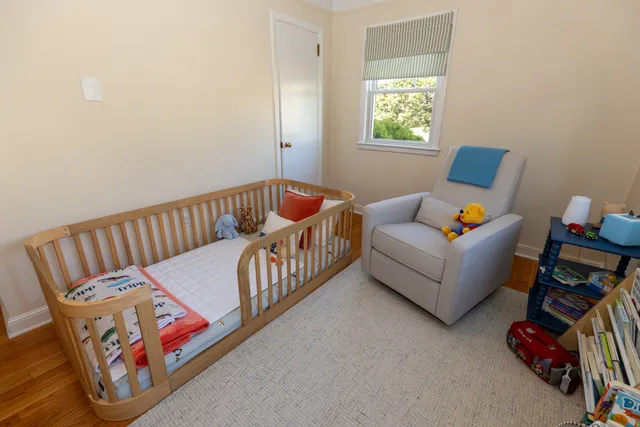 a bedroom with furniture and a window