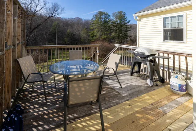 a view of a patio with iron fence