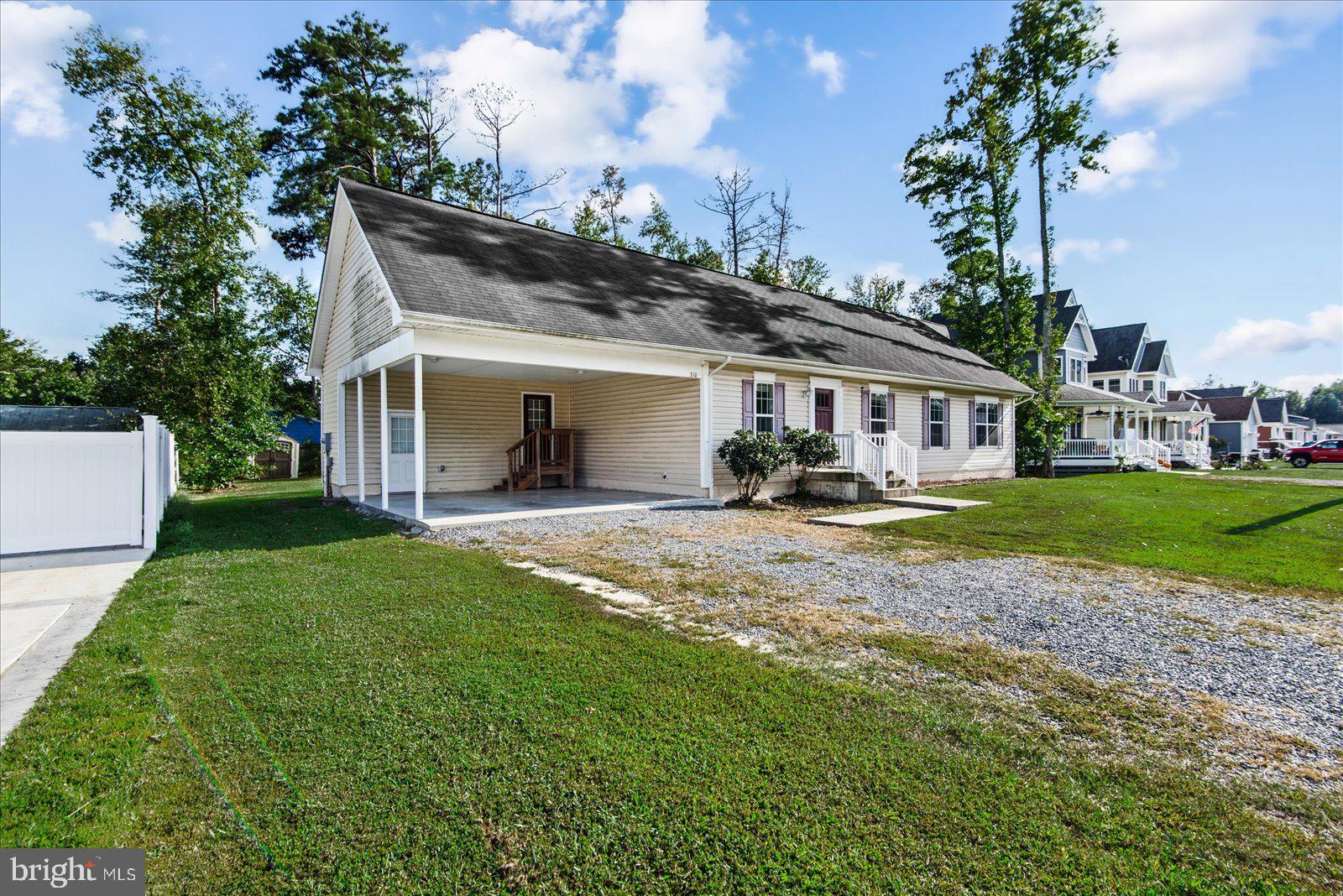310 3rd Street Colonial Beach, VA 22443 - Photo 3 of 38 a view of house with yard and outdoor seating