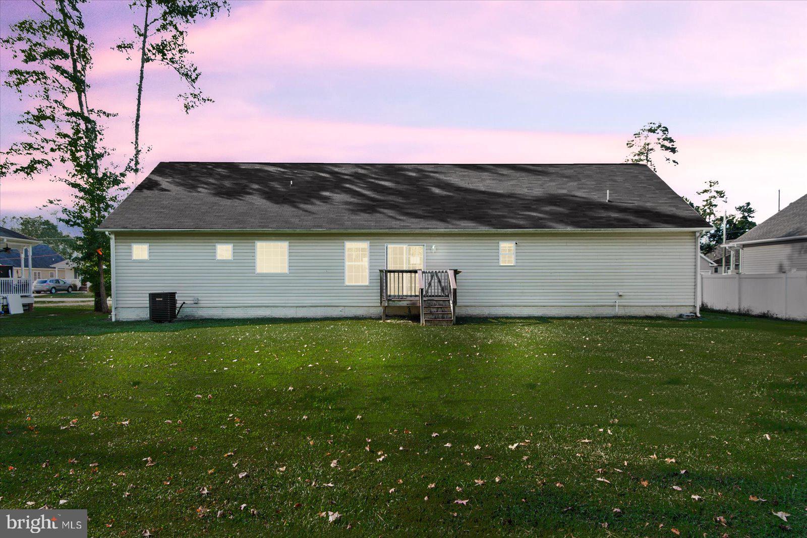 310 3rd Street Colonial Beach, VA 22443 - Photo 33 of 38 a backyard of a house with lots of green space