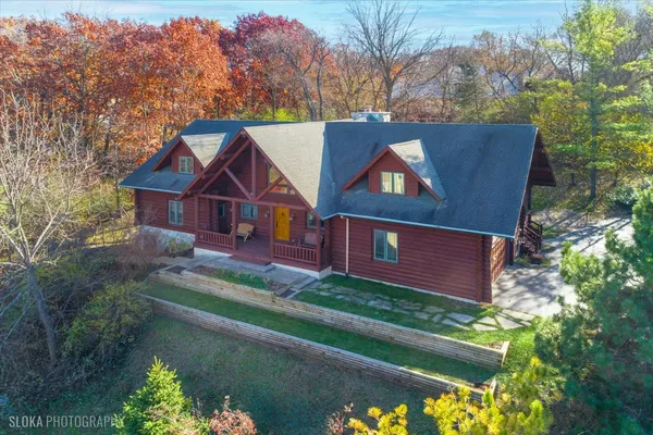 a view of house with a yard