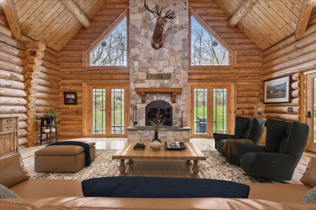 a living room with furniture fireplace and flat screen tv