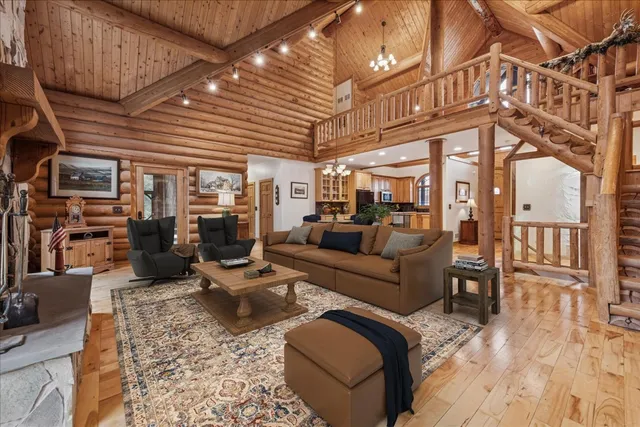 a kitchen with stainless steel appliances granite countertop wooden cabinets a oven and a sink