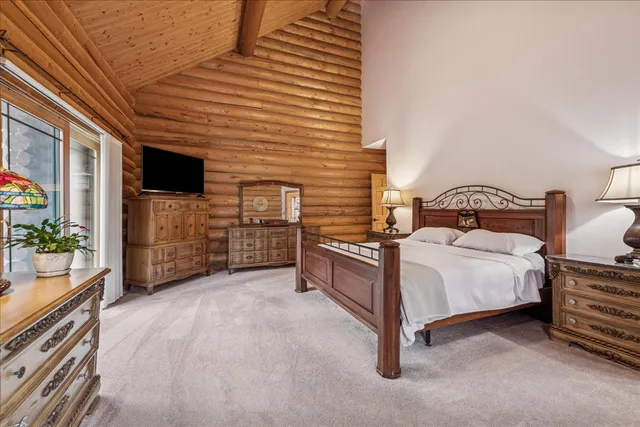 a bedroom with a bed and walk in closet