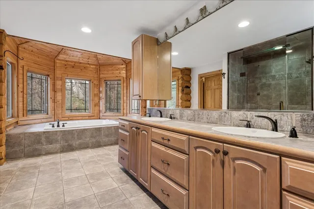a bath tub sitting in front of a window