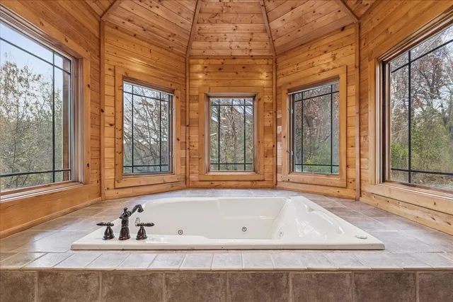 a bedroom with furniture and a bed