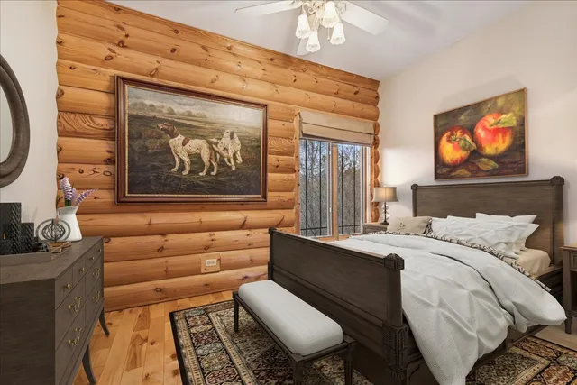 a bathroom with a granite countertop sink a mirror and a shower