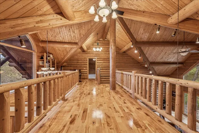 a living room with furniture a rug and white walls