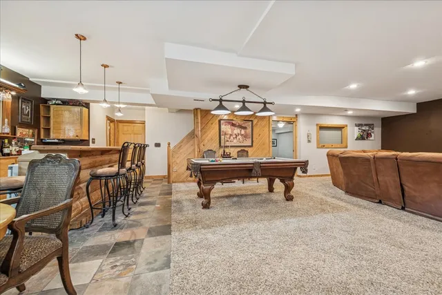 a room with lots of furniture and a large window