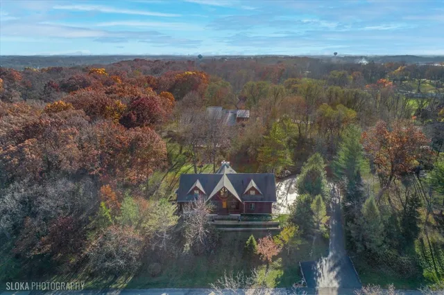 an aerial view of house with yard swimming pool and mountain view