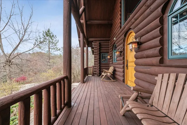 a view of balcony with wooden floor and outdoor seating