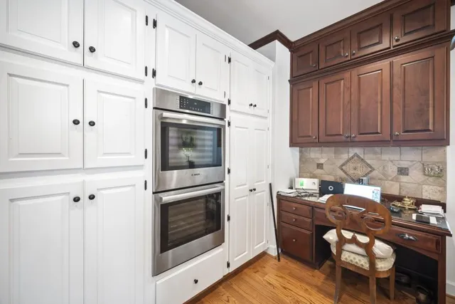 a kitchen with stainless steel appliances a stove a microwave and cabinets