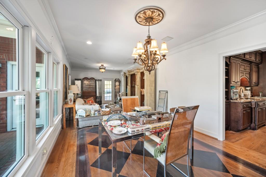 988 Grantham Way Southwest Marietta, GA 30064 - Photo 20 of 51 a view of a dining room with furniture wooden floor and chandelier