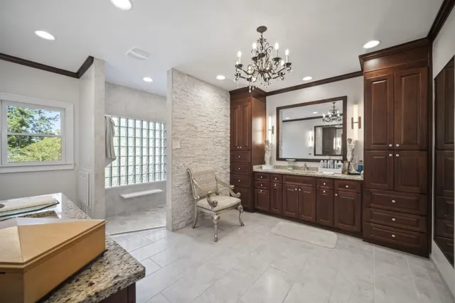 a living room with furniture and a bathroom