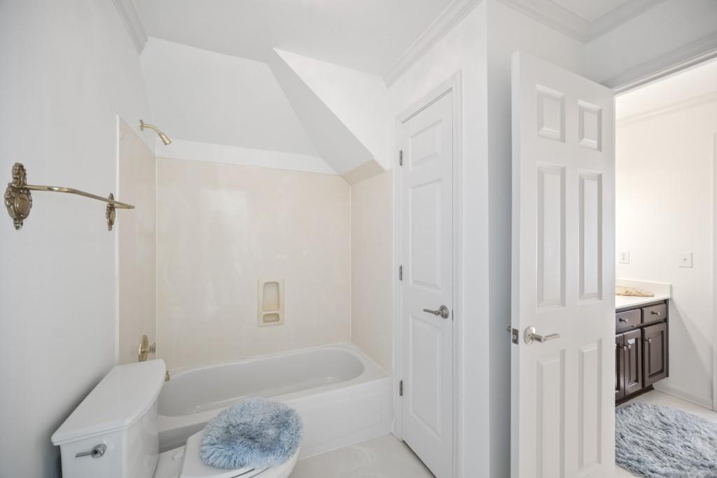 988 Grantham Way Southwest Marietta, GA 30064 - Photo 38 of 51 a bathroom with a bathtub a toilet and a shower