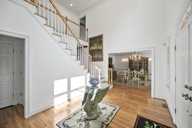 a living room with lots of furniture and wooden floor