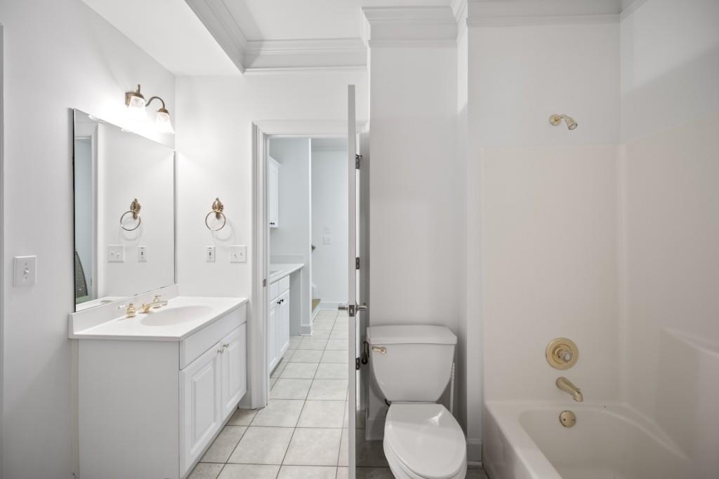 988 Grantham Way Southwest Marietta, GA 30064 - Photo 44 of 51 a bathroom with a toilet sink shower and mirror