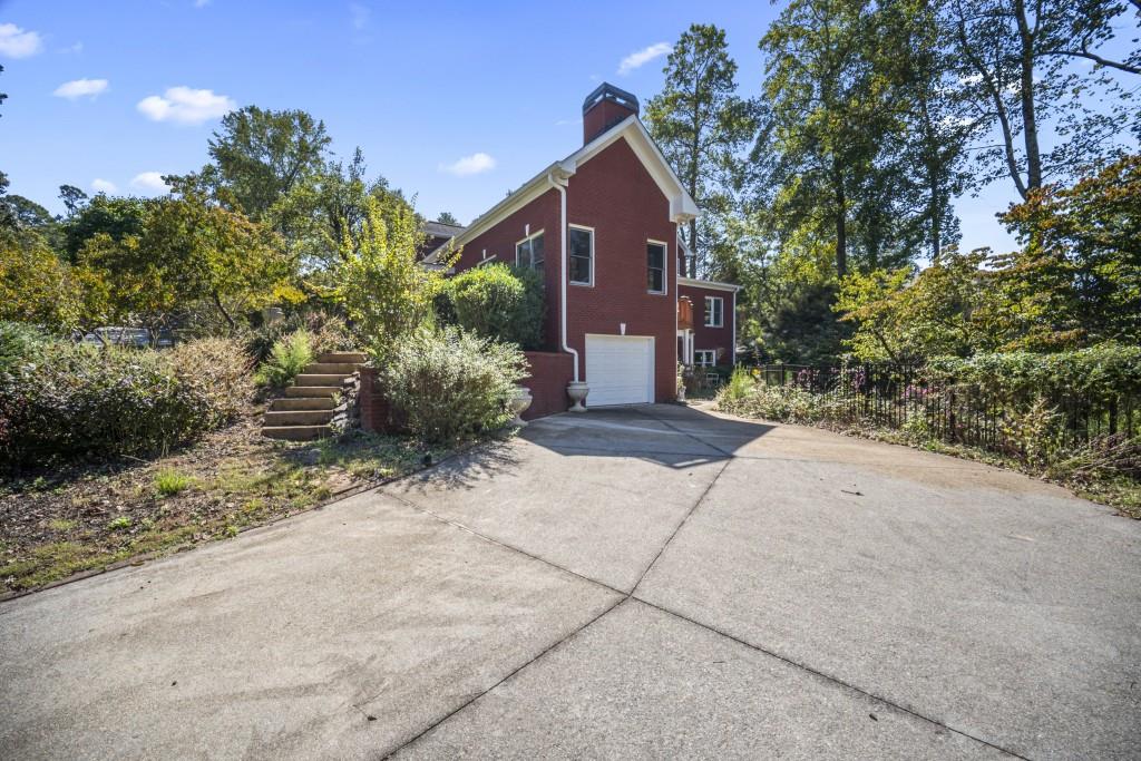 988 Grantham Way Southwest Marietta, GA 30064 - Photo 45 of 51 a view of a house with a yard and tree