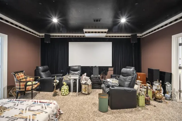 a view of a chair and tables in the balcony