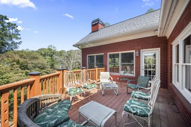 an aerial view of a house with yard swimming pool and outdoor seating
