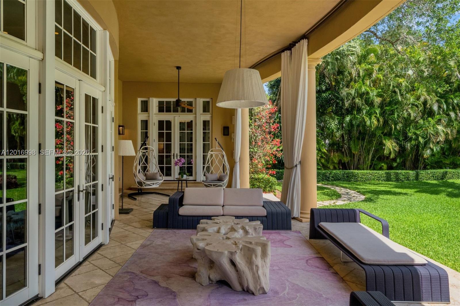 4790 Southwest 78th Street Miami, FL 33143 - Photo 24 of 33 a view of a patio with couches and potted plants