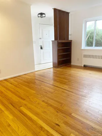 a kitchen with stainless steel appliances granite countertop a stove a sink and white cabinets