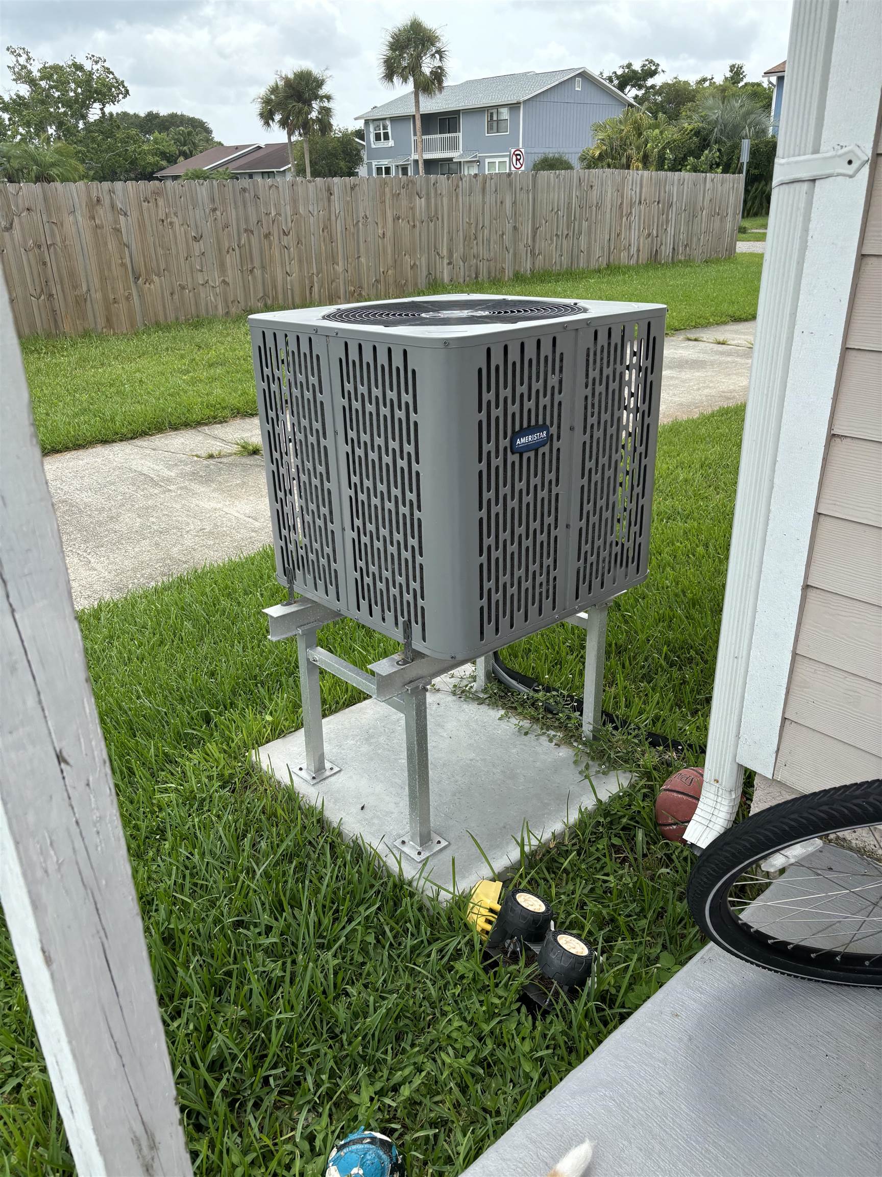 124 Rio Del Mar Street, Unit C St. Augustine, FL 32080 - Photo 20 of 27 a view of a chair and table in the back yard of the house