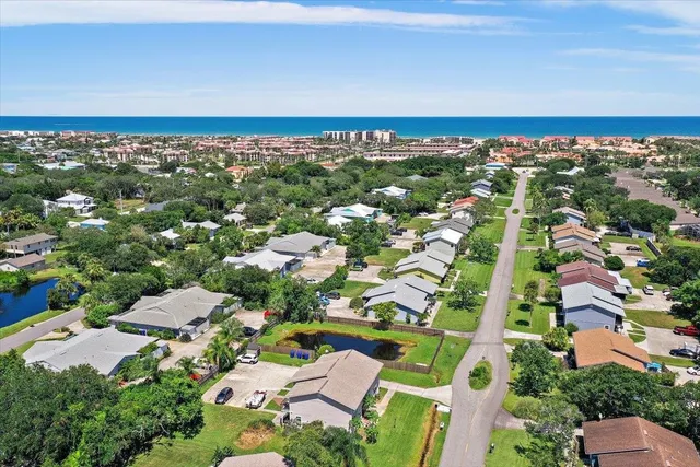 an aerial view of residential houses with outdoor space