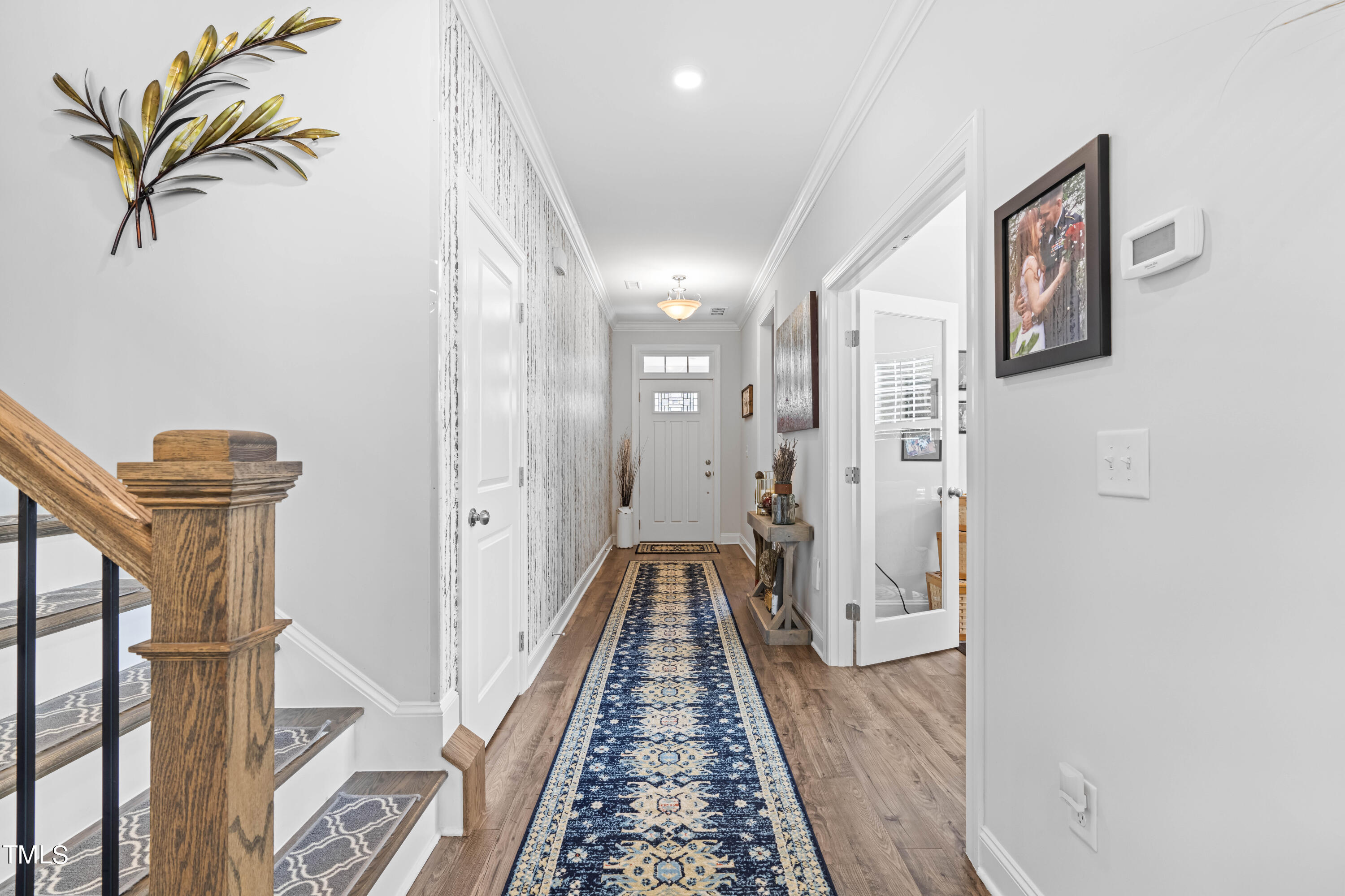 190 Hidden Bluff Drive Pittsboro, NC 27312 - Photo 11 of 58 a view of a hallway with wooden floor and staircase