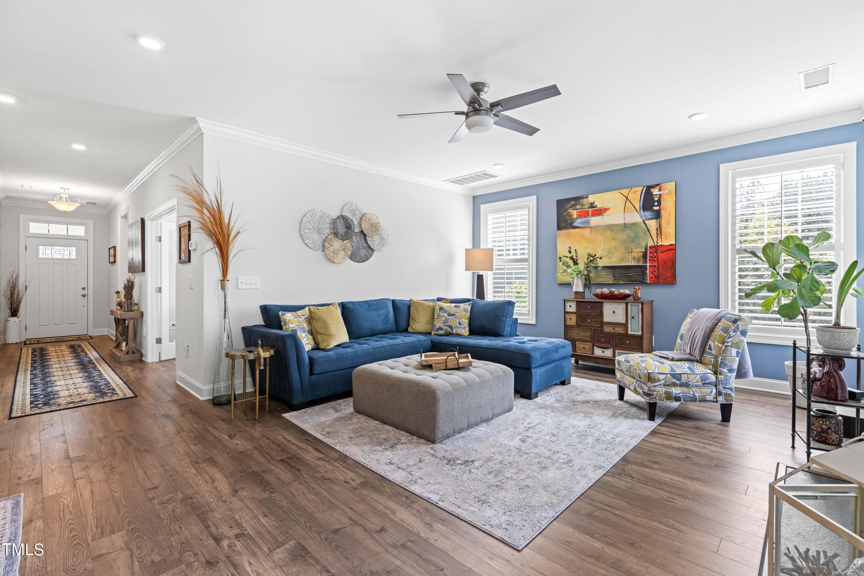 190 Hidden Bluff Drive Pittsboro, NC 27312 - Photo 14 of 58 a living room with furniture and a flat screen tv