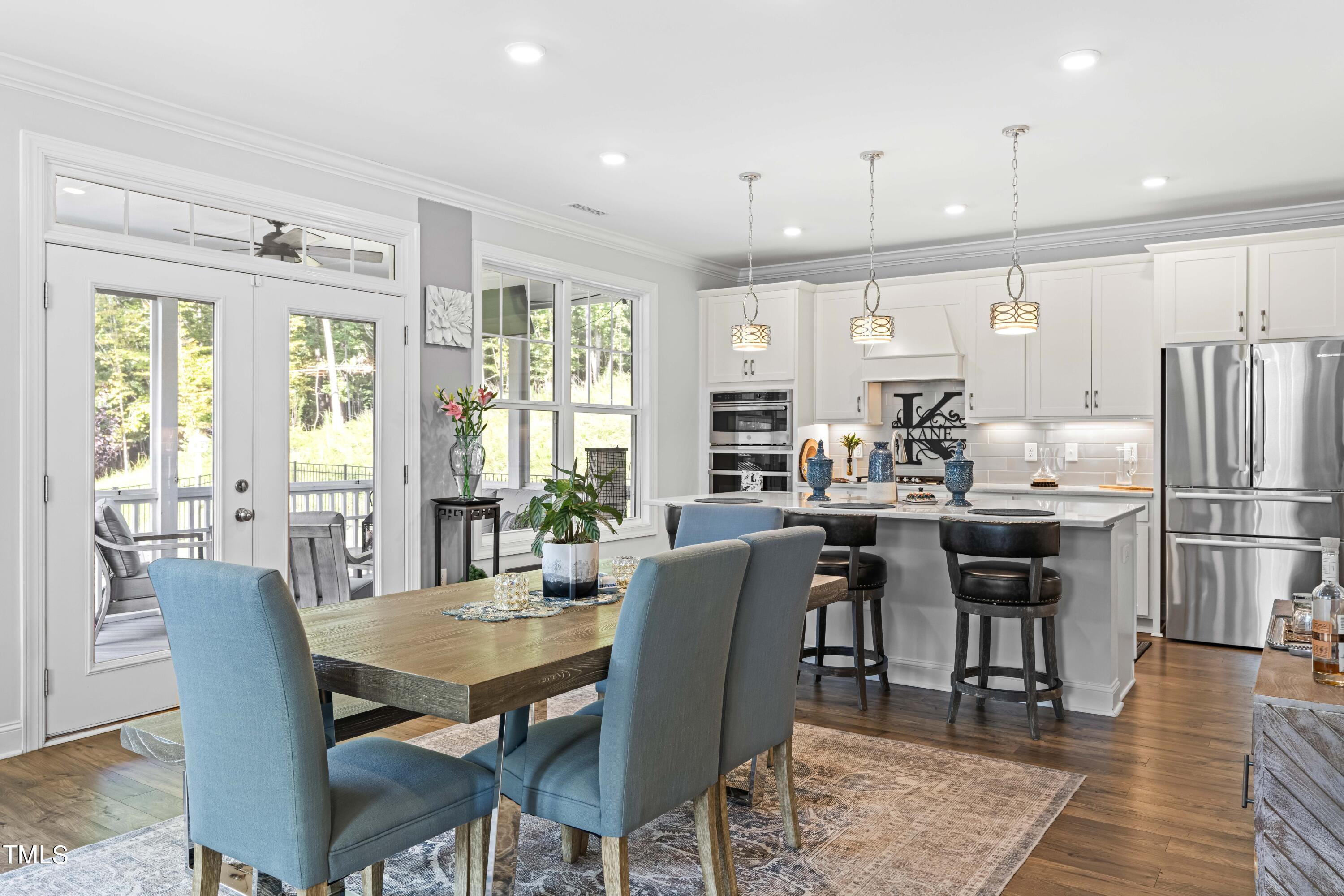 190 Hidden Bluff Drive Pittsboro, NC 27312 - Photo 18 of 58 a view of a dining room with furniture window and wooden floor