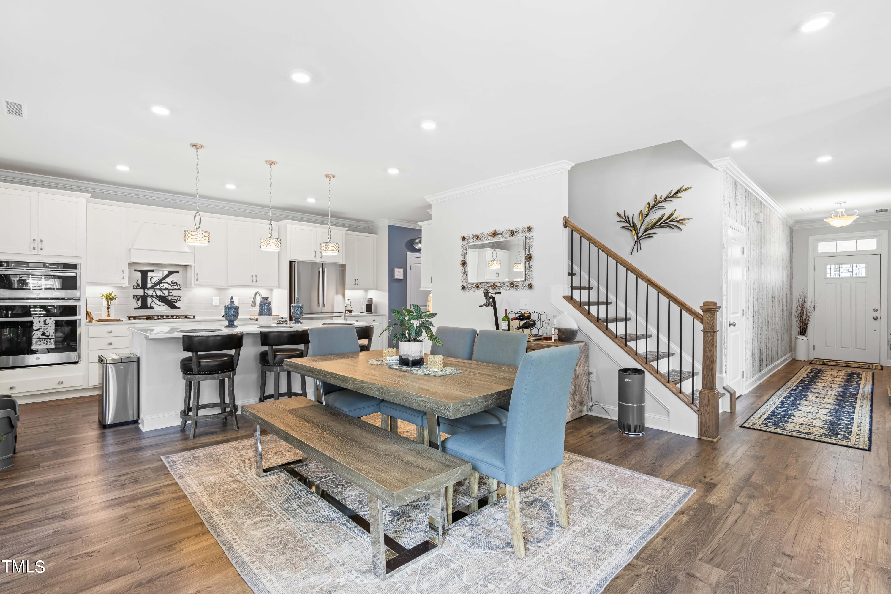 190 Hidden Bluff Drive Pittsboro, NC 27312 - Photo 19 of 58 a living room with lots of furniture and kitchen view with wooden floor