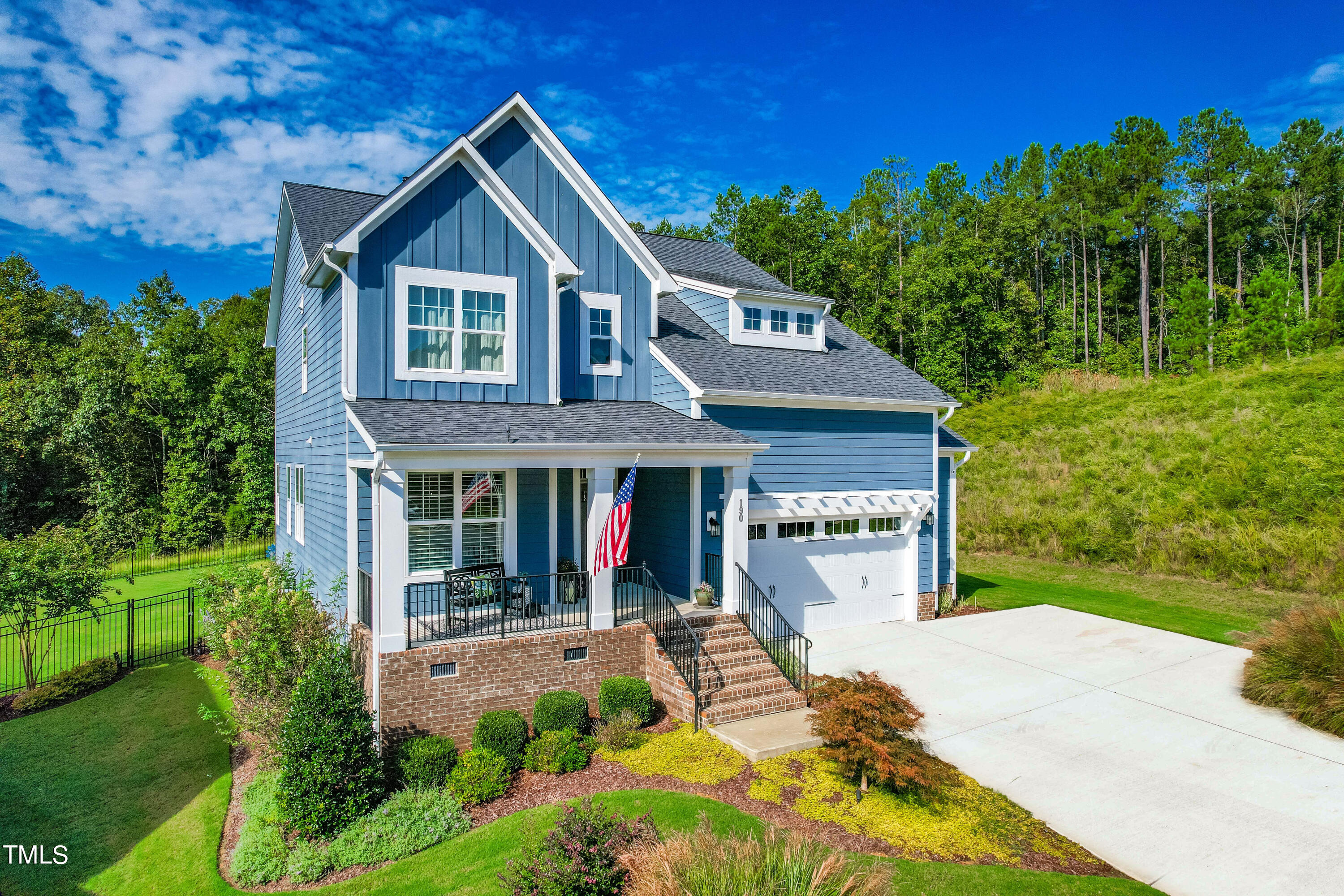 190 Hidden Bluff Drive Pittsboro, NC 27312 - Photo 2 of 58 a front view of a house with garden