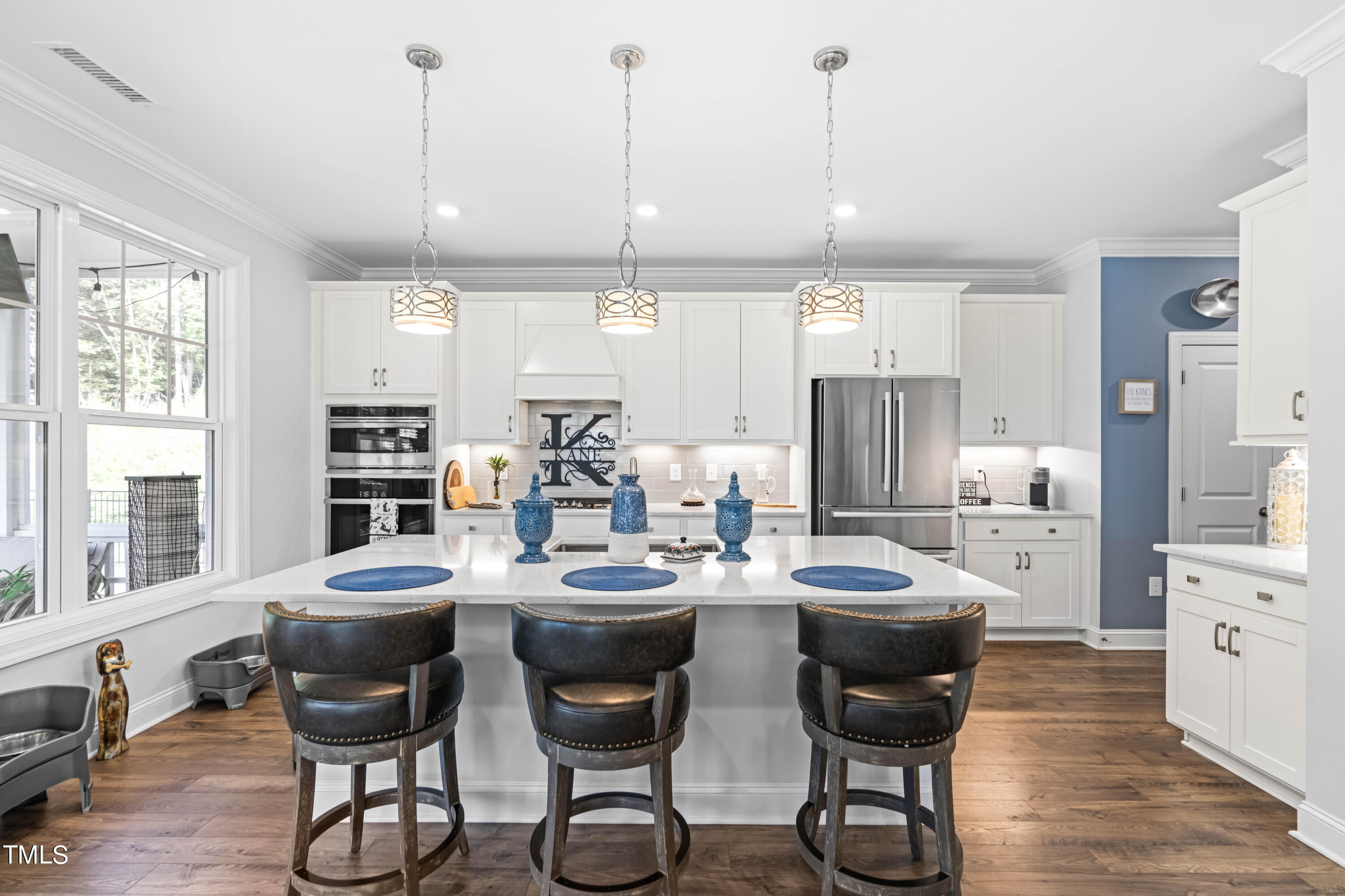 190 Hidden Bluff Drive Pittsboro, NC 27312 - Photo 22 of 58 a view of a dining room and livingroom with furniture wooden floor a rug a chandelier