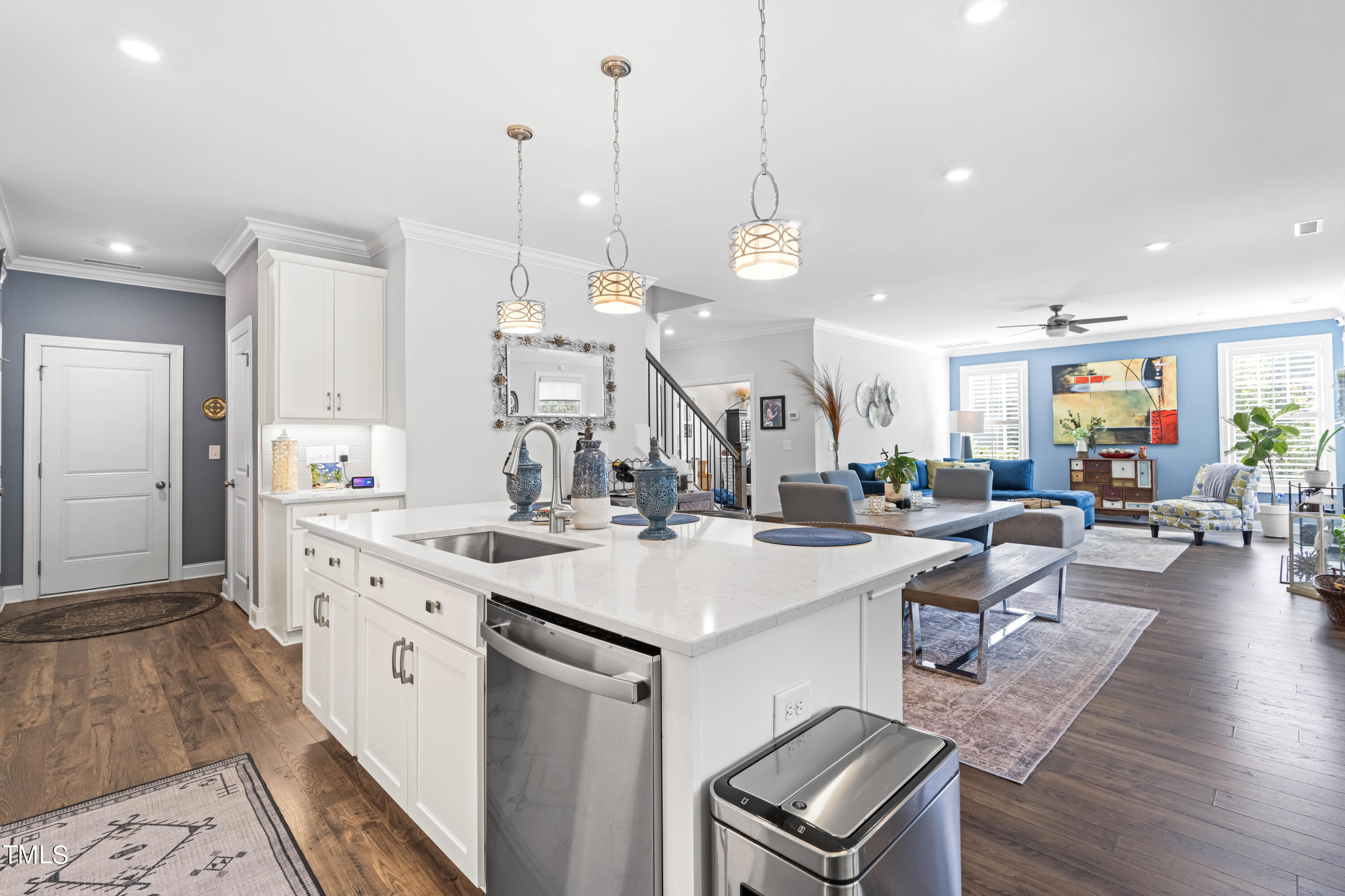 190 Hidden Bluff Drive Pittsboro, NC 27312 - Photo 25 of 58 a open kitchen with stainless steel appliances granite countertop a kitchen island a stove and a view of living room with windows