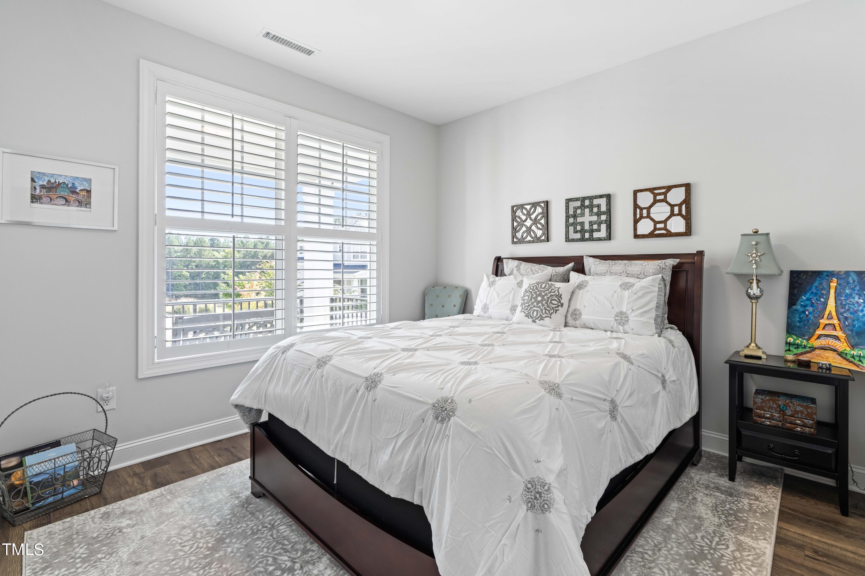 190 Hidden Bluff Drive Pittsboro, NC 27312 - Photo 27 of 58 a large bed sitting in a bedroom next to a window