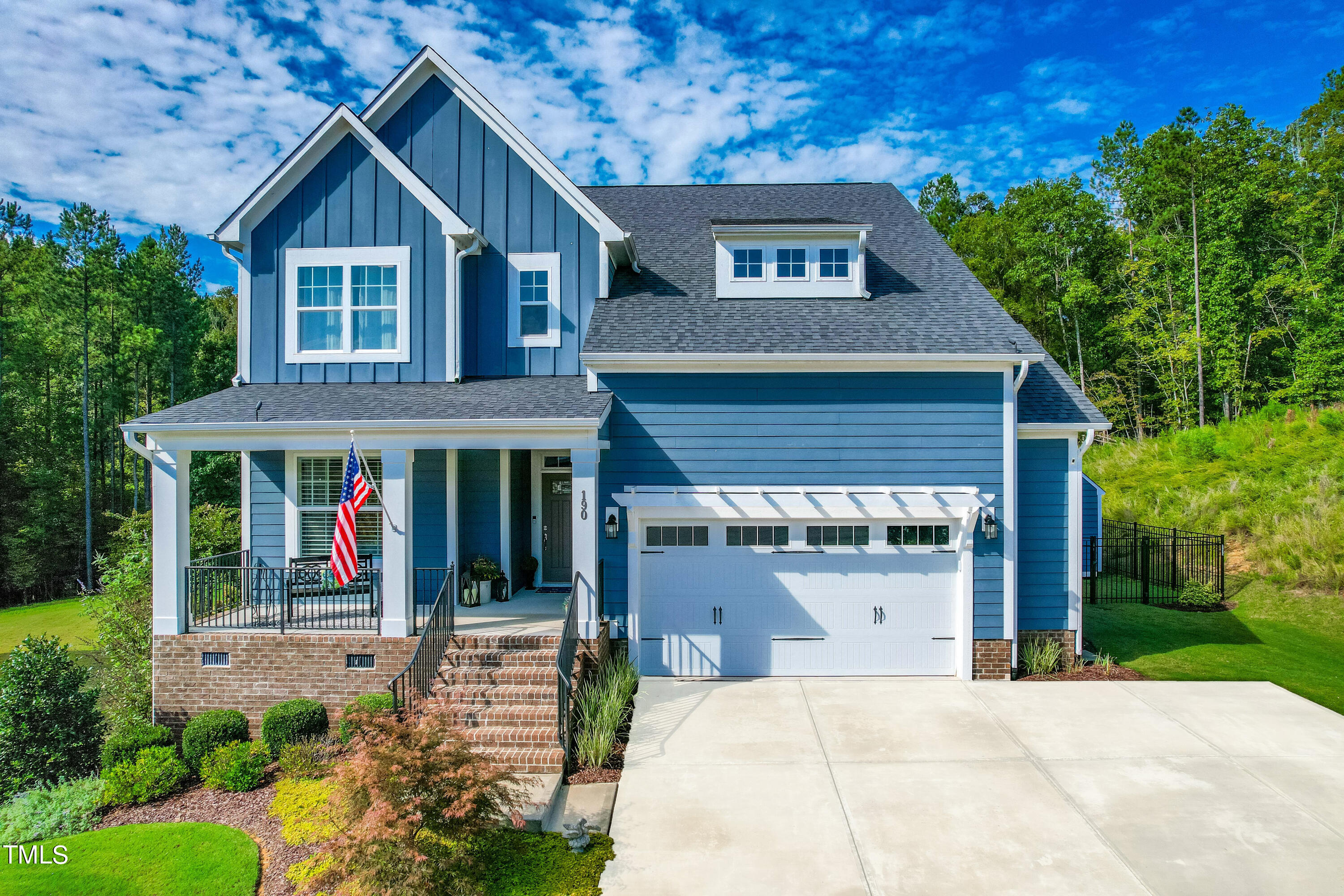 190 Hidden Bluff Drive Pittsboro, NC 27312 - Photo 3 of 58 a front view of a house with garden