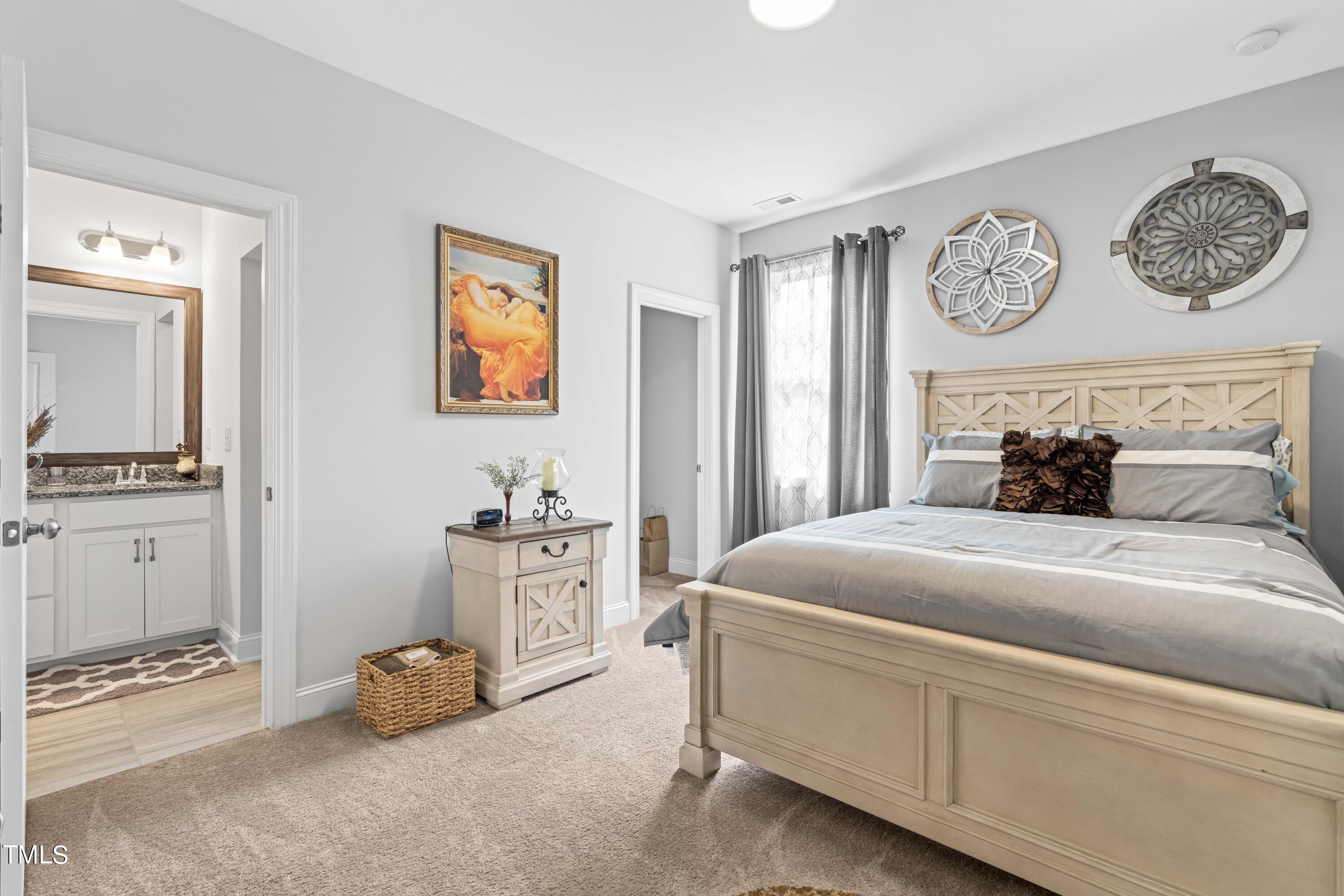 190 Hidden Bluff Drive Pittsboro, NC 27312 - Photo 31 of 58 a bedroom with a bed and cabinets