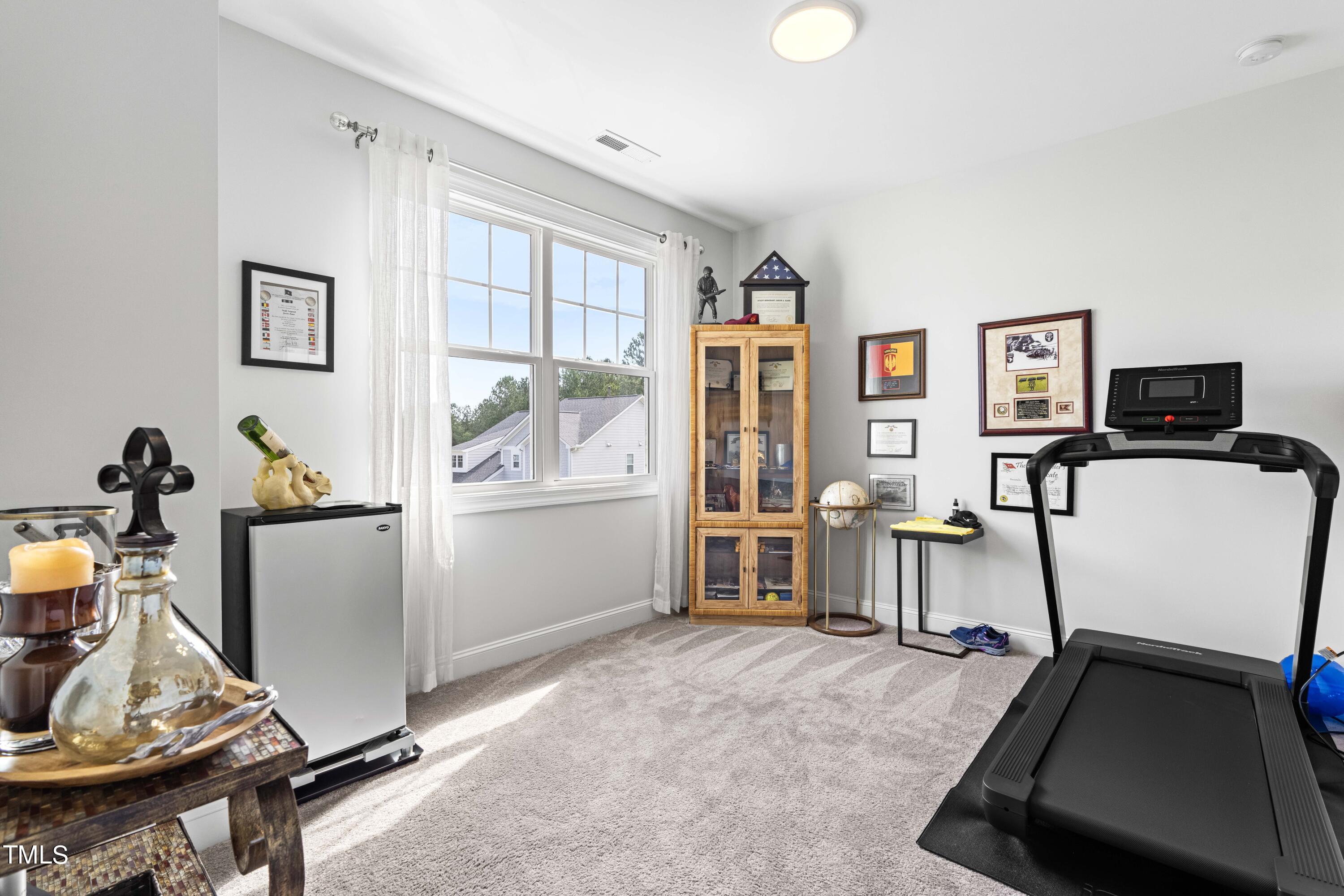 190 Hidden Bluff Drive Pittsboro, NC 27312 - Photo 33 of 58 a view of a room with gym equipment