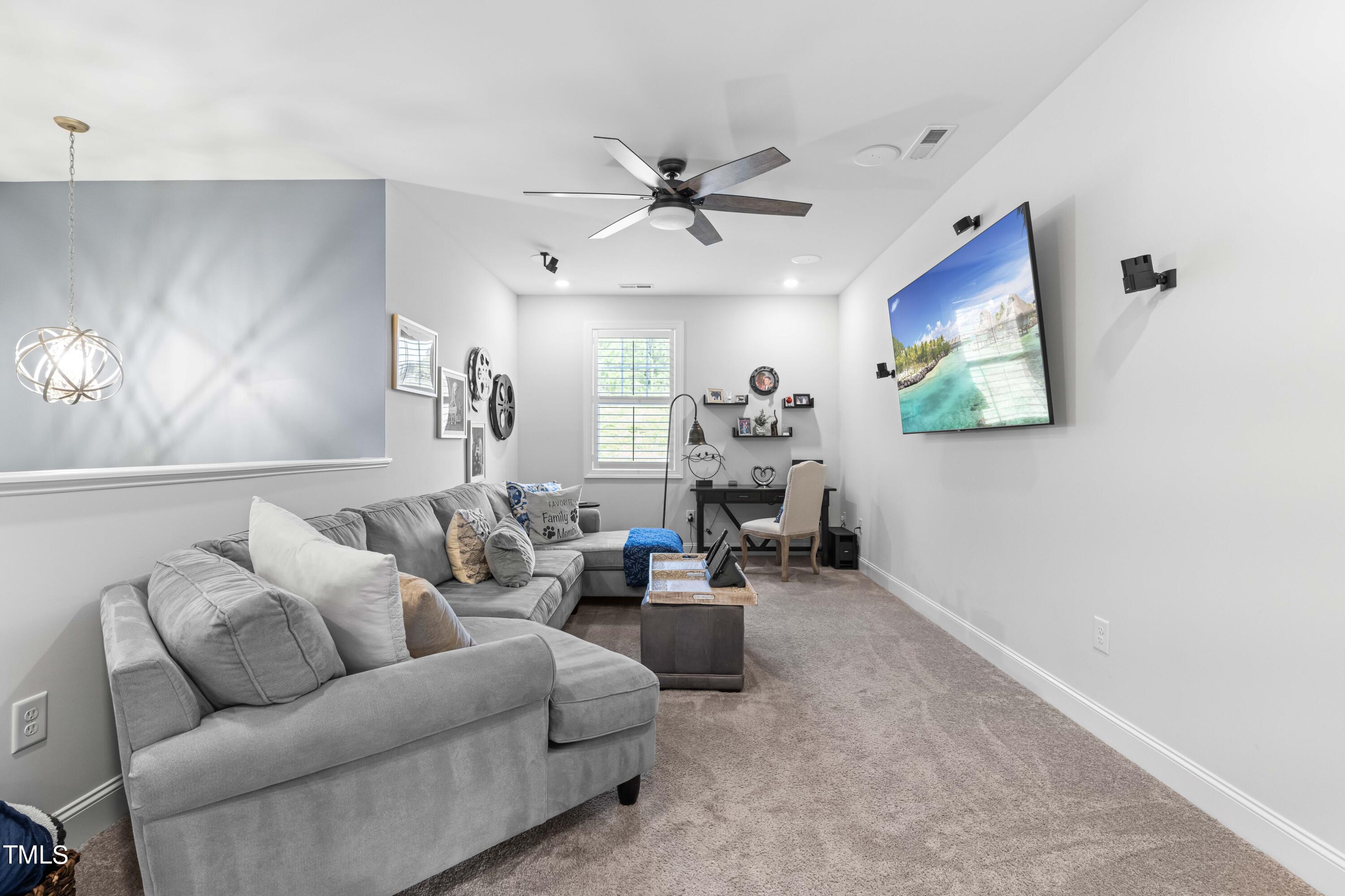 190 Hidden Bluff Drive Pittsboro, NC 27312 - Photo 35 of 58 a living room with furniture and a ceiling fan