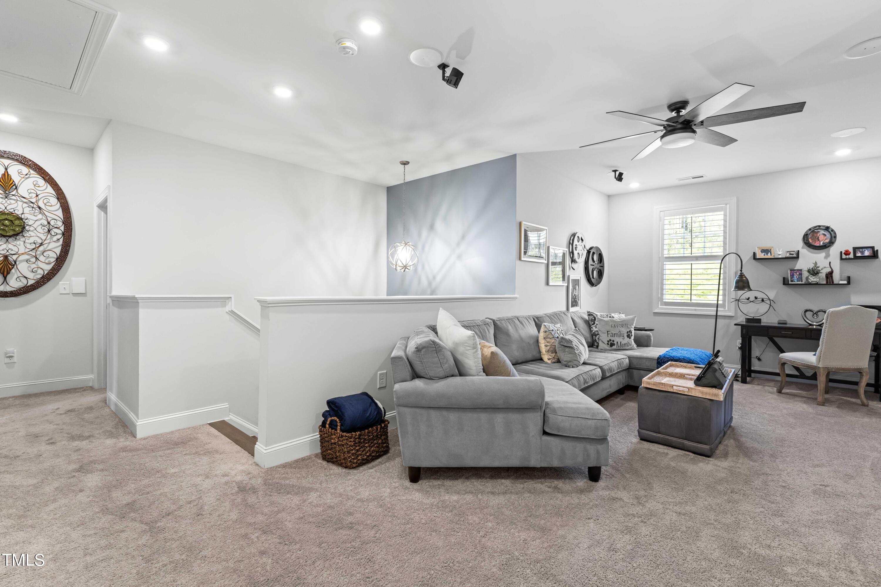 190 Hidden Bluff Drive Pittsboro, NC 27312 - Photo 36 of 58 a living room with furniture and a large window