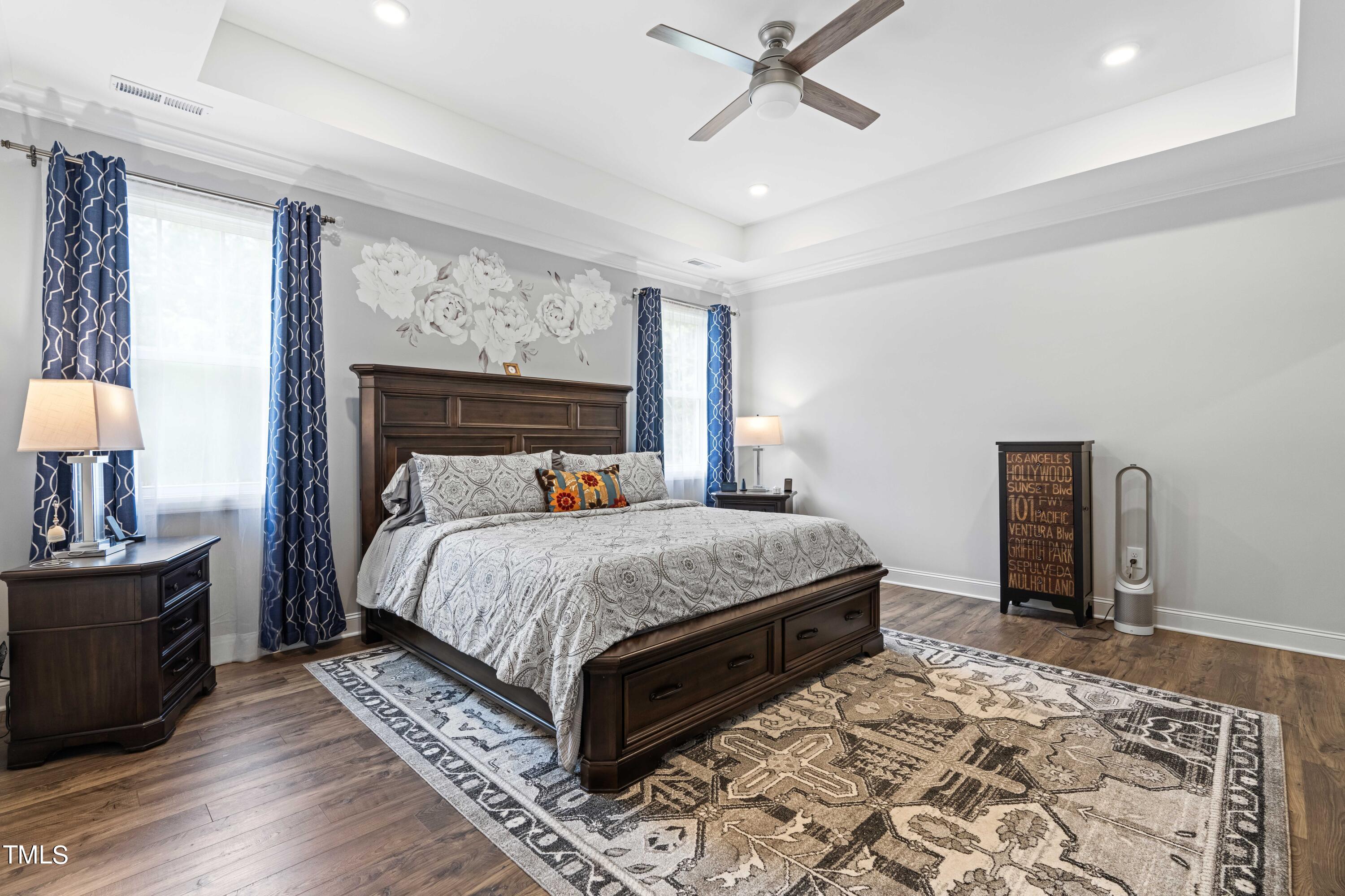 190 Hidden Bluff Drive Pittsboro, NC 27312 - Photo 37 of 58 a bedroom with a large bed a chandelier and dresser