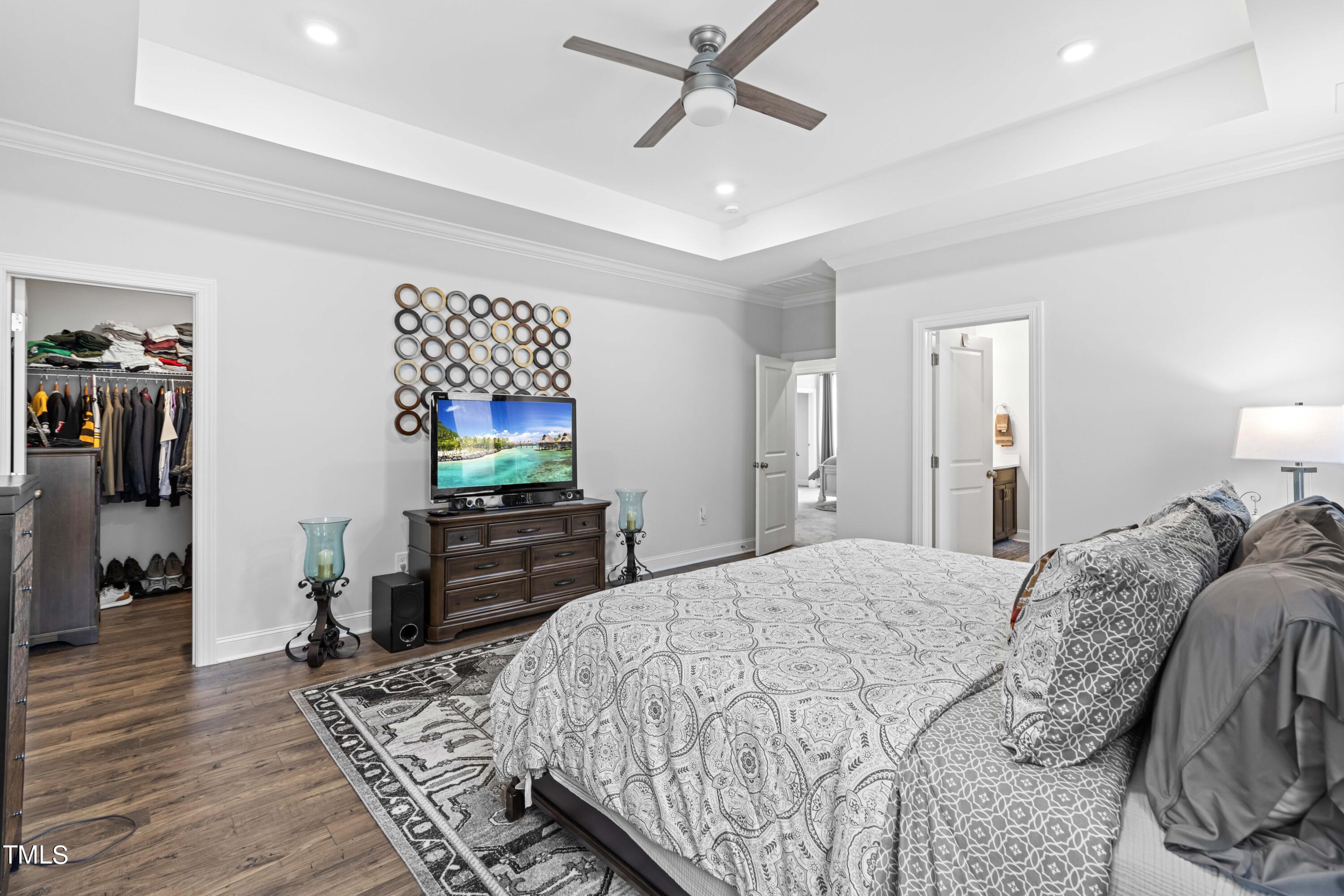 190 Hidden Bluff Drive Pittsboro, NC 27312 - Photo 39 of 58 a bedroom with a bed and a flat screen tv