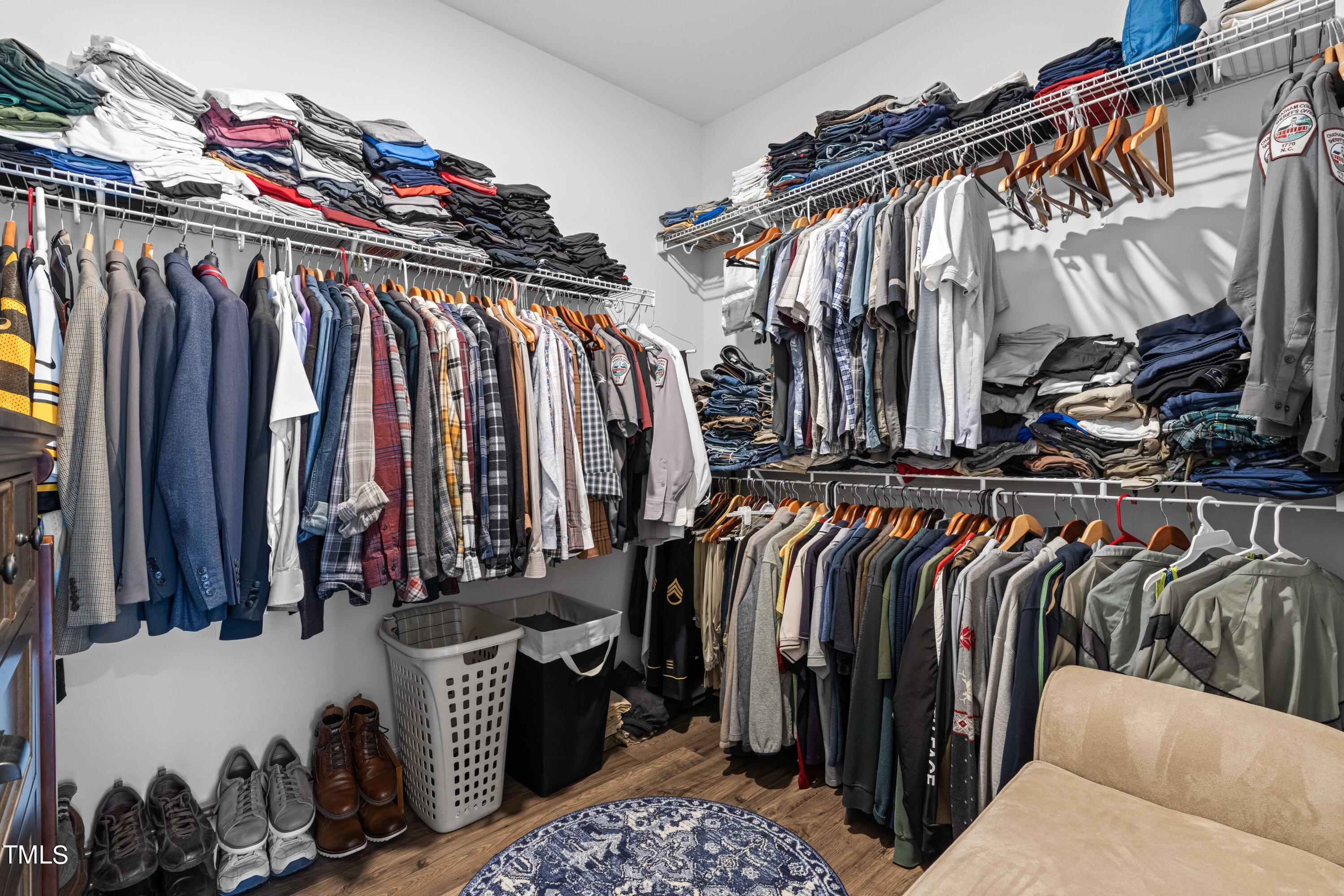 190 Hidden Bluff Drive Pittsboro, NC 27312 - Photo 40 of 58 a view of walk in closet with clothes and shoes