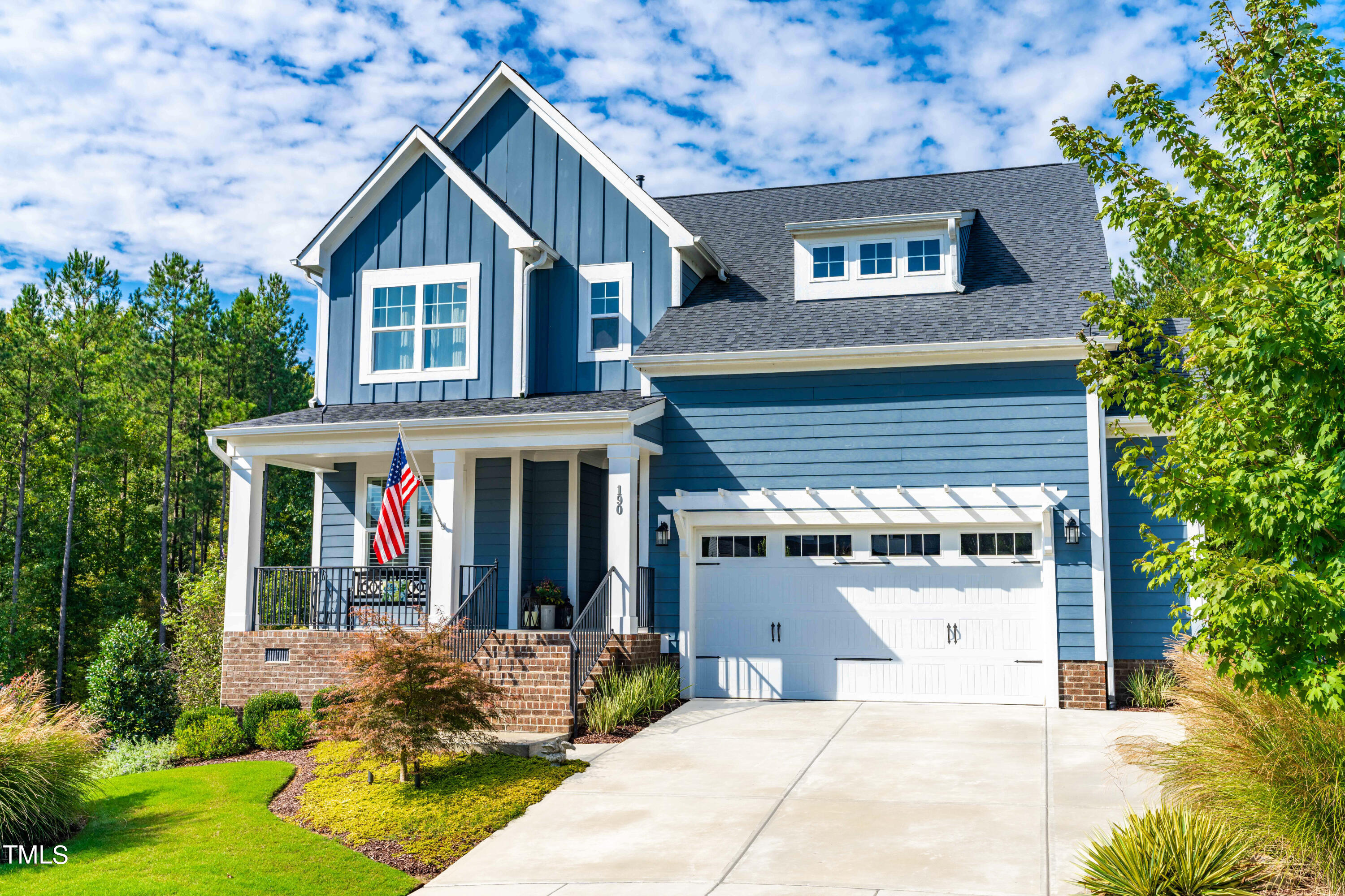 190 Hidden Bluff Drive Pittsboro, NC 27312 - Photo 4 of 58 a front view of a house with garden