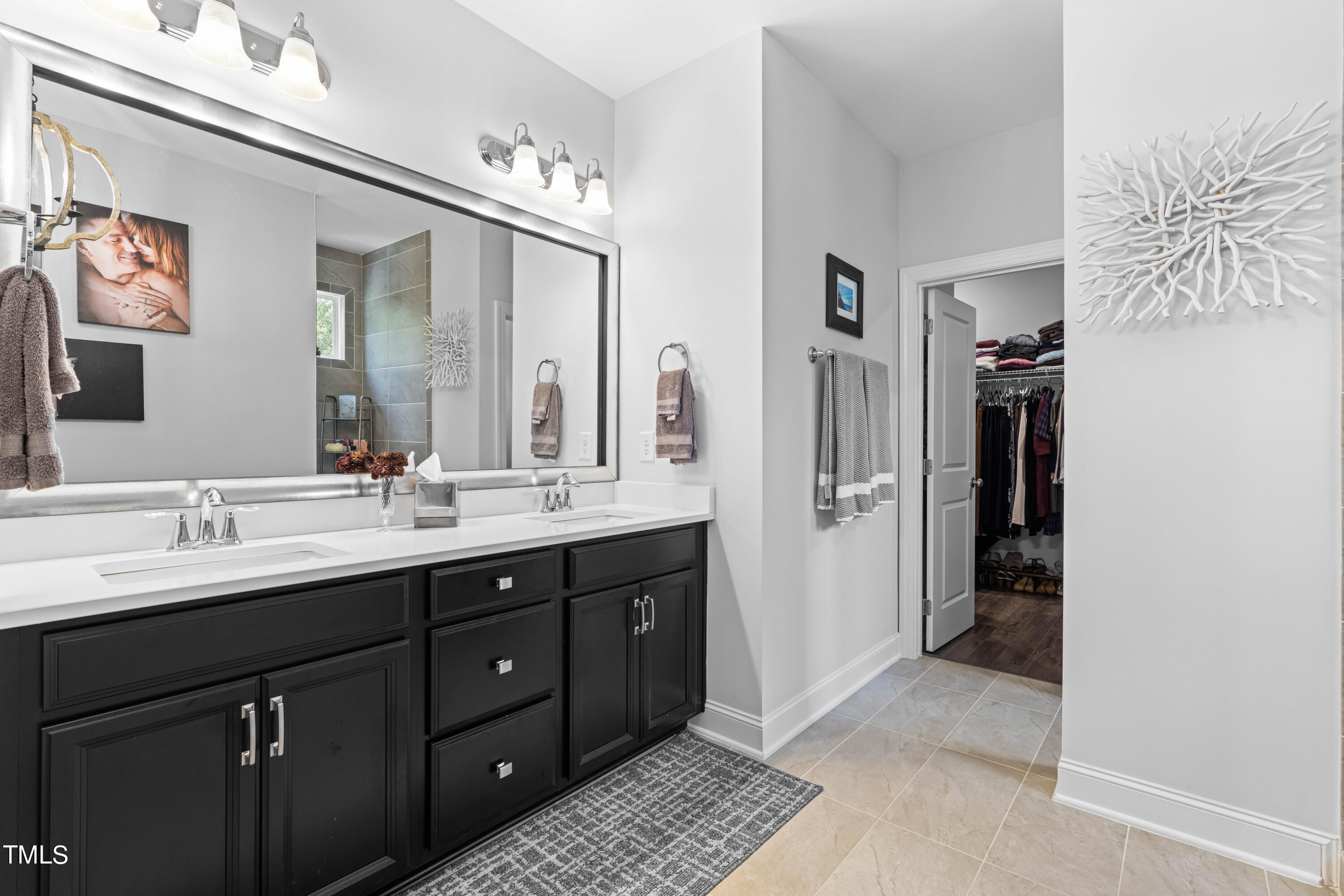 190 Hidden Bluff Drive Pittsboro, NC 27312 - Photo 41 of 58 a bathroom with a double vanity sink and a mirror
