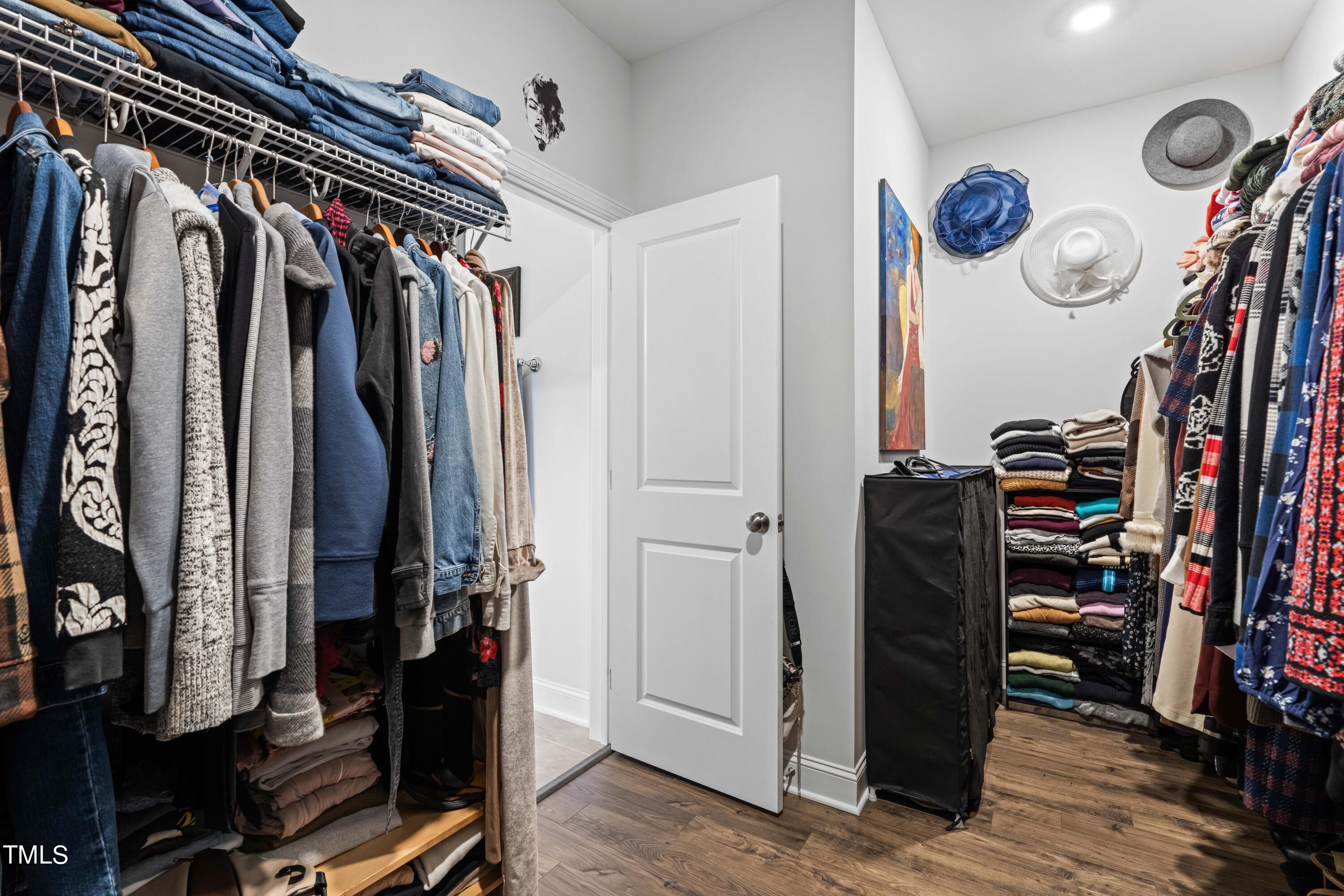 190 Hidden Bluff Drive Pittsboro, NC 27312 - Photo 42 of 58 a view of walk in closet with clothes and shoes
