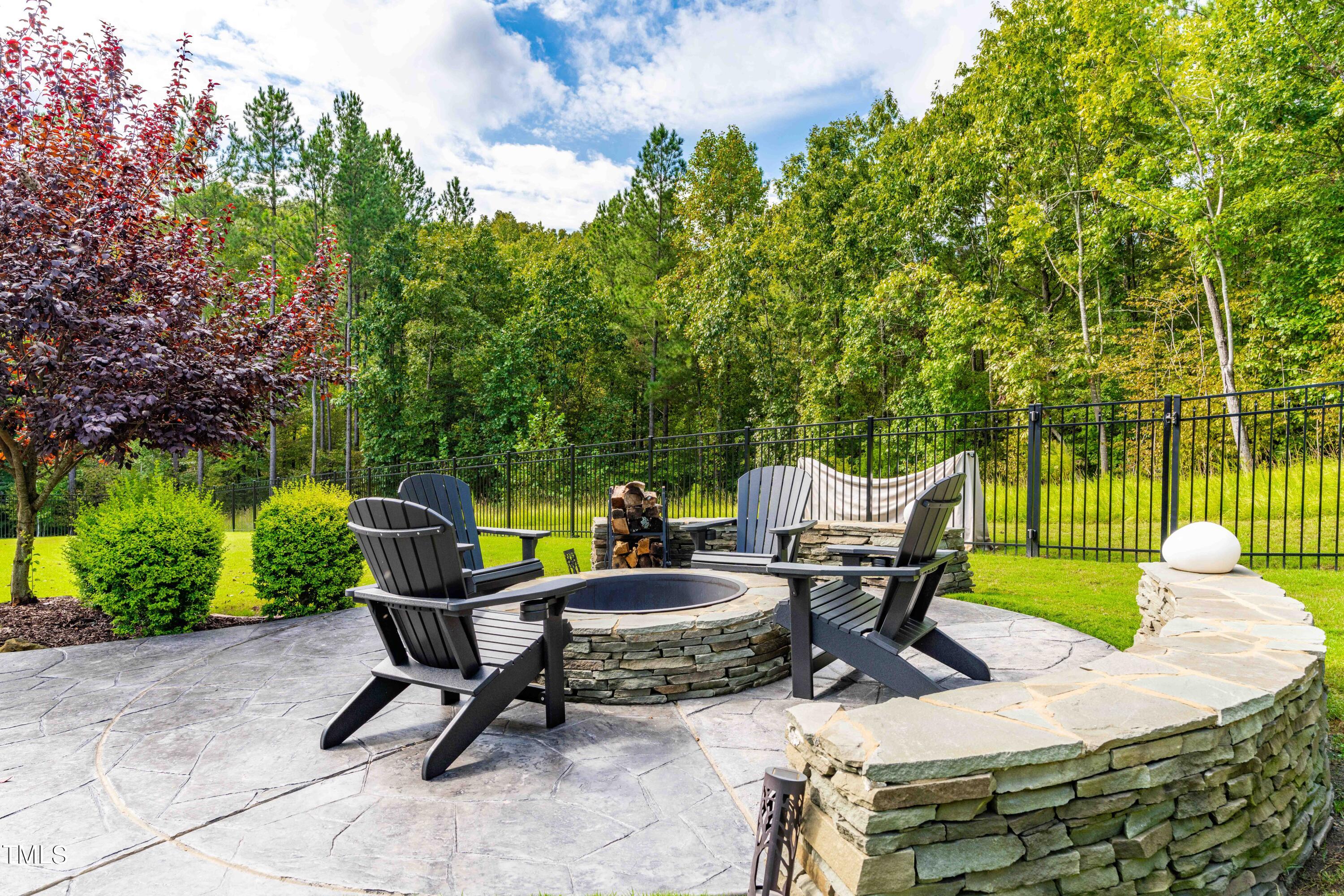 190 Hidden Bluff Drive Pittsboro, NC 27312 - Photo 51 of 58 a view of a patio with a table chairs and a potted plant